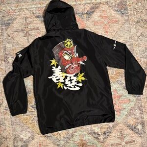 Lightweight Wind breaker w/ Draw string Hood and 2 Front pockets. XL